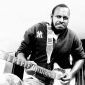 “Gitar Kapok warna hitam oranye, pemberian kakak yang menjadi teman bermain melodi sejak 2009.”