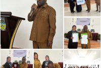 Bupati Deiyai, Melkianus Mote (tengah), didampingi oleh Kepala BPJS Ketenagakerjaan Cabang Nabire, Mustika (kanan), saat acara Sosialisasi Program Jaminan Sosial dan penandatanganan kerja sama antara Pemkab Deiyai dan BPJS Ketenagakerjaan.
